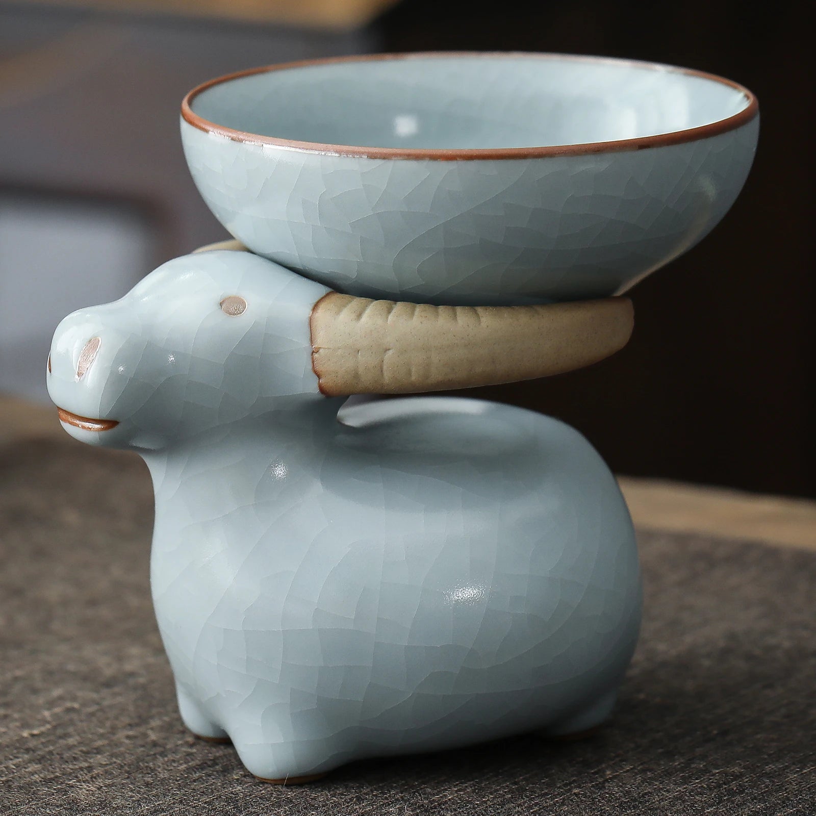 http://www.teanagoo.com/cdn/shop/products/Handmade_Tea_Strainer_and_Holder_Tea_Set_Creative_Tea_Accessories_Ceramic_Ruyao_Teaware_LCQ05-01.jpg?v=1668492633